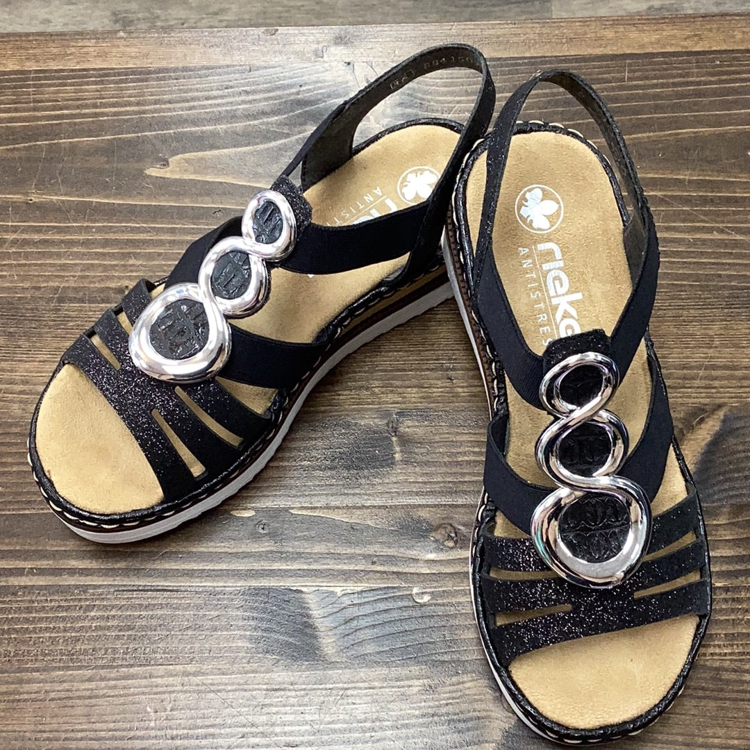 Rieker 679L4-00 Black  Sparkle Strap sandal with metal detail.